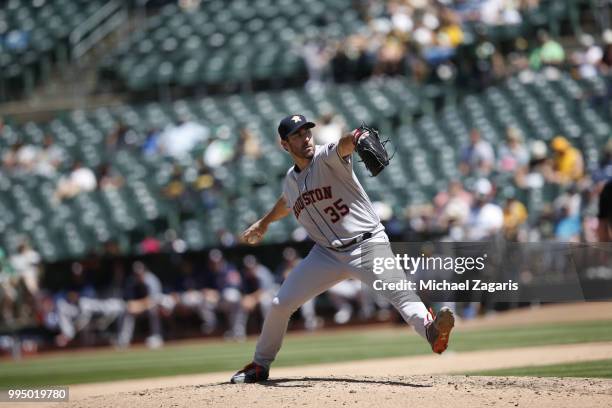 Justin Verlander of the Houston Astros pitches during the game against the Oakland Athletics at the Oakland Alameda Coliseum on June 14, 2018 in...