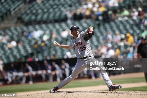 Justin Verlander of the Houston Astros pitches during the game against the Oakland Athletics at the Oakland Alameda Coliseum on June 14, 2018 in...