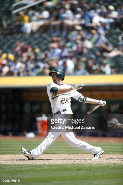 Stephen Piscotty of the Oakland Athletics bats during the game against the Houston Astros at the Oakland Alameda Coliseum on June 14, 2018 in...