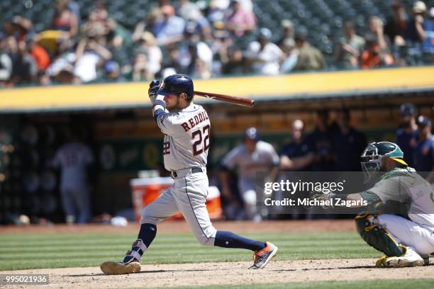 Josh Reddick of the Houston Astros bats during the game against the Oakland Athletics at the Oakland Alameda Coliseum on June 14, 2018 in Oakland,...