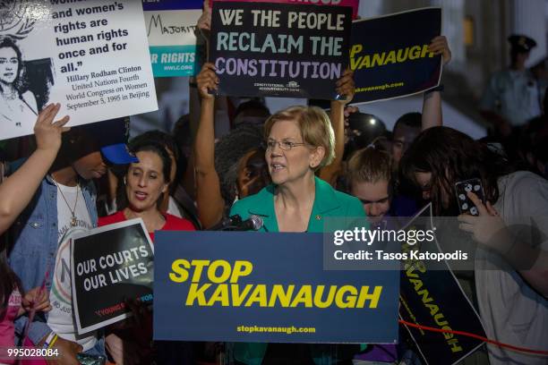 Senator Elizabeth Warren speaks to protesters in front of the U.S. Supreme Court on July 9, 2018 in Washington, DC. President Donald Trump is set to...