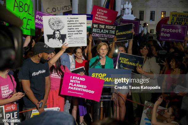 Senator Elizabeth Warren speaks to protesters in front of the U.S. Supreme Court on July 9, 2018 in Washington, DC. President Donald Trump is set to...