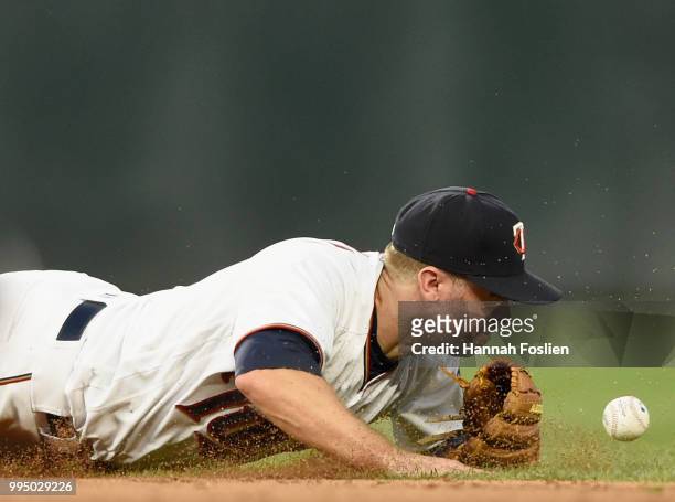 Brian Dozier of the Minnesota Twins is unable to field a ball off the bat of Rosell Herrera of the Kansas City Royals at second base during the sixth...