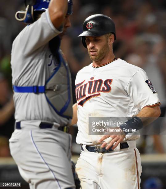 Joe Mauer of the Minnesota Twins scores a run in the seventh inning of the game on July 9, 2018 at Target Field in Minneapolis, Minnesota. The Twins...