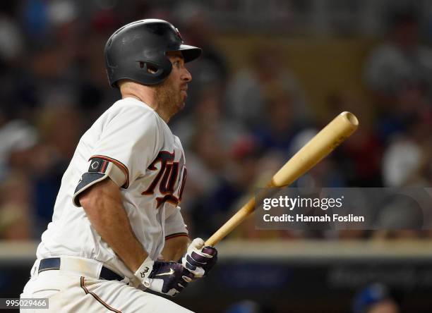 Joe Mauer of the Minnesota Twins hits an RBI single against the Kansas City Royals in the eighth inning of the game on July 9, 2018 at Target Field...