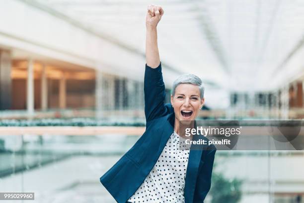 business triumph - women cheering stock pictures, royalty-free photos & images