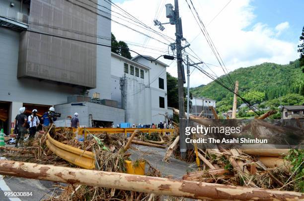 Driftwood scatters outside Asahishuzo after heavy rain on July 9, 2018 in Iwakuni, Yamaguchi, Japan. The death toll from the torrential rain in...