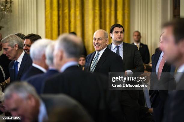 John Kelly, White House chief of staff, center left, and John DeStefano, assistant and counsellor to U.S. President Donald Trump, center right,...