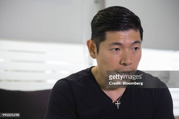 Anthony Tan, co-founder and chief executive officer of Grab, speaks during an interview in Singapore, on Monday, July 9, 2018. Grab is opening its...