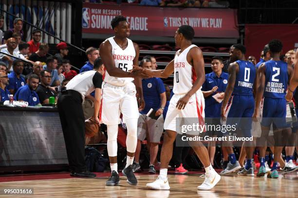 Danuel House of the Houston Rockets shakes hands with De'Anthony Melton of the Houston Rockets during the game against the LA Clippers during the...