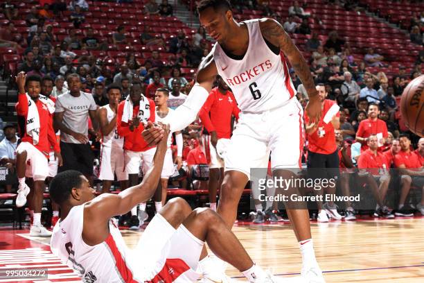 Vincent Edwards of the Houston Rockets helps De'Anthony Melton of the Houston Rockets from the floor during the 2018 Las Vegas Summer League on July...