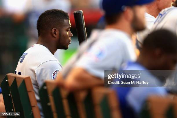 Yasiel Puig of the Los Angeles Dodgers looks on from the bench during the ninth inning of a game against the Los Angeles Angels of Anaheim at Angel...
