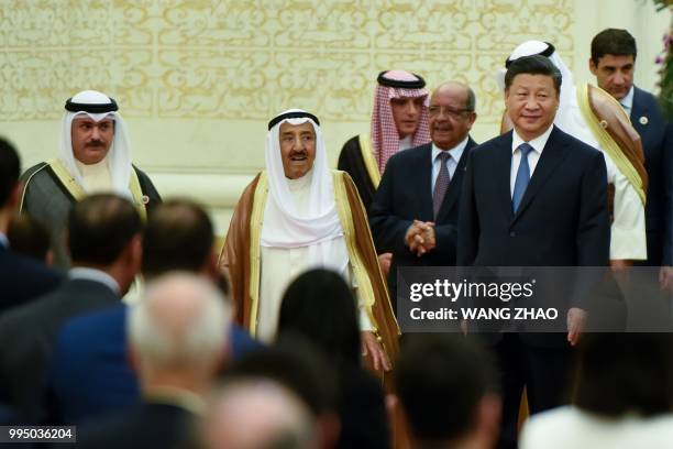 China's President Xi Jinping and Kuwaiti ruling Emir Sheikh Sabah al-Ahmad al-Jaber al-Sabah arrive for the 8th Ministerial Meeting of China-Arab...