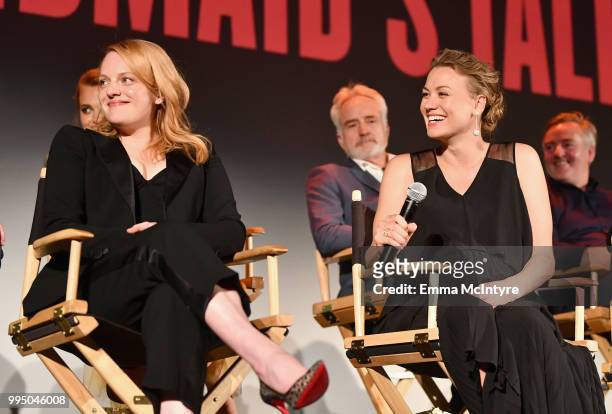 Elisabeth Moss and Yvonne Strahovski speak onstage during "The Handmaid's Tale" Hulu finale at The Wilshire Ebell Theatre on July 9, 2018 in Los...