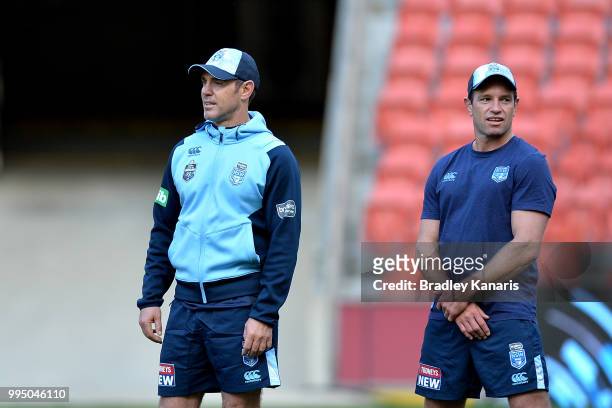 Coach Brad Fittler and Danny Buderus watch on during the New South Wales Blues State of Origin Captain's Run at Suncorp Stadium on July 10, 2018 in...