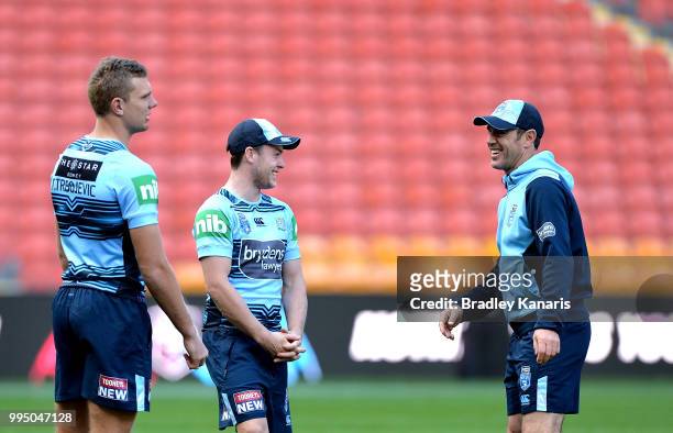 Coach Brad Fittler, Luke Keary and Tom Trbojevic share a laugh during the New South Wales Blues State of Origin Captain's Run at Suncorp Stadium on...
