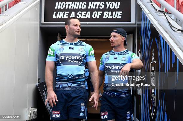 Boyd Cordner and Damien Cook enter the field during the New South Wales Blues State of Origin Captain's Run at Suncorp Stadium on July 10, 2018 in...