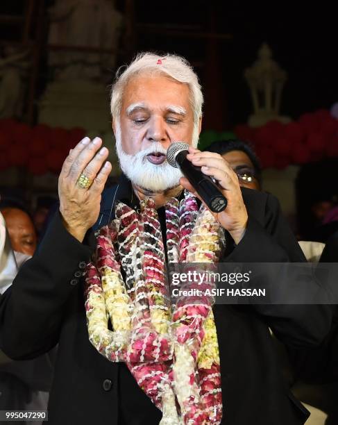 Newly-appointed Pakistani Cardinal, Joseph Coutts prays during a welcoming ceremony at Saint Patrick Church in Karachi on July 10 after his visit to...