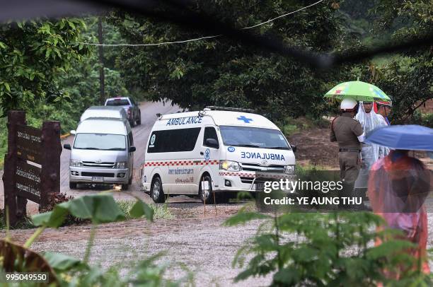 An ambulance leaves from the Tham Luang cave area as the operations continue for those still trapped inside the cave in Khun Nam Nang Non Forest Park...
