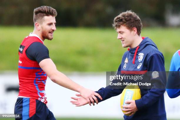 Marcus Bontempelli of the Bulldogs and Jackson Macrae of the Bulldogs shake hands during a Western Bulldogs AFL media opportunity at Whitten Oval on...
