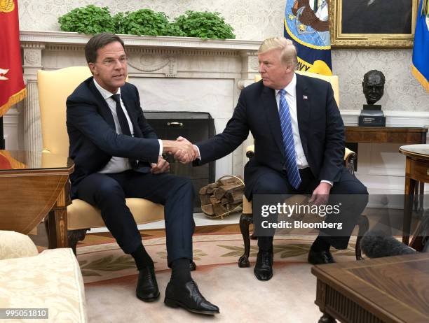 Mark Rutte, Netherland's prime minister, shakes hands with U.S. President Donald Trump, right, during a meeting at the White House in Washington,...