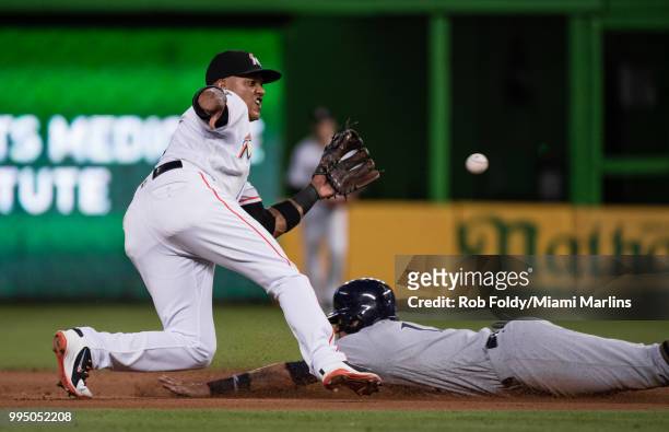 Starlin Castro of the Miami Marlins tags out a baserunner during the game against the Milwaukee Brewers at Marlins Park on July 9, 2018 in Miami,...