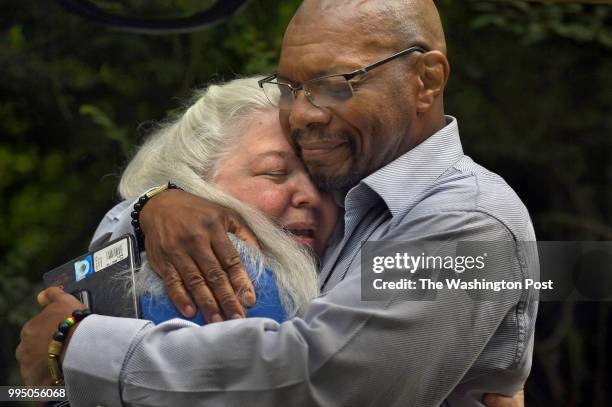 Historic researcher Jane Smith gets a hug of thanks from Don Gathers just after the ceremony that acknowledged a brutal lynching 120 years ago. It...