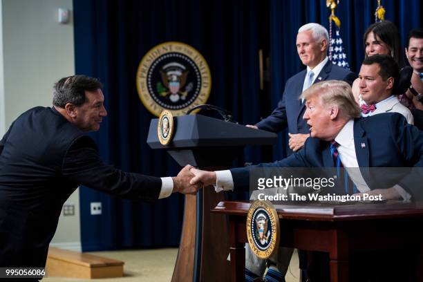 Sen. Joe Donnelly, D-Ind., greets President Donald J. Trump after Trump signed S. 204, the Right to Try Act in the South Court Auditorium of the...