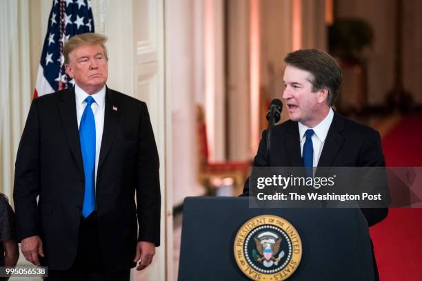 President Donald J. Trump listens to Judge Brett M. Kavanaugh of the District of Columbia Circuit, as he speaks during an announcement ceremony for...