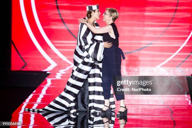 Model Rosanna Zanetti and Designer Nuria Sarda walks the runway at the 'Andres Sarda' catwalk during the Mercedes-Benz Madrid Fashion Week...