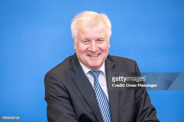 German Interior Minister Horst Seehofer presents his "master plan" concerning migration policy on July 10, 2018 in Berlin, Germany. The plan includes...