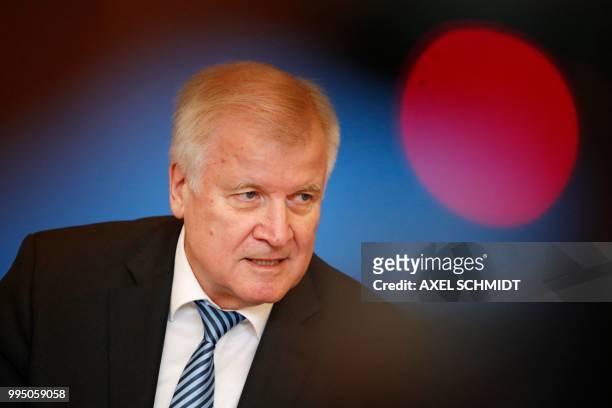 German Interior Minister Horst Seehofer attends a press conference to present his long-delayed "Masterplan on Migration" which had sparked a...
