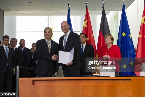 Zeng Yuqun, chief executive officer of Contemporary Amperex Technology Ltd., left, and Wolfgang Tiefensee, state premier of Thueringia and Social...