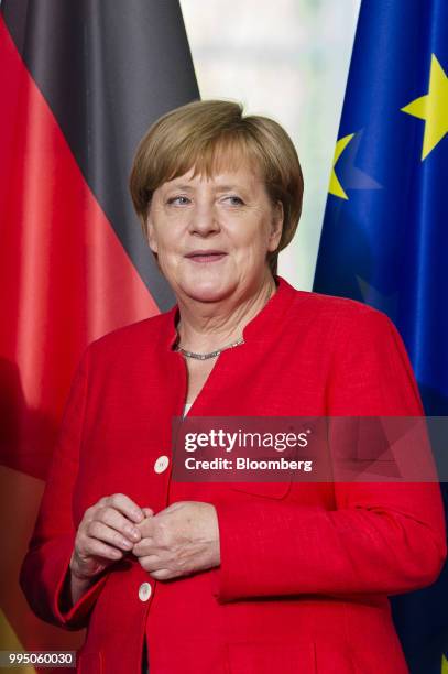 Angela Merkel, Germany's chancellor, attends a business contract signing session at the Chancellery building in Berlin, Germany, on Monday, July 9,...