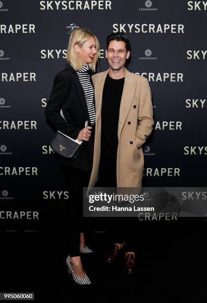 Nikki Phillips and Dane Rumble attend the SKYSCRAPER Sydney Premiere at Event Cinemas George Street on July 10, 2018 in Sydney, Australia.