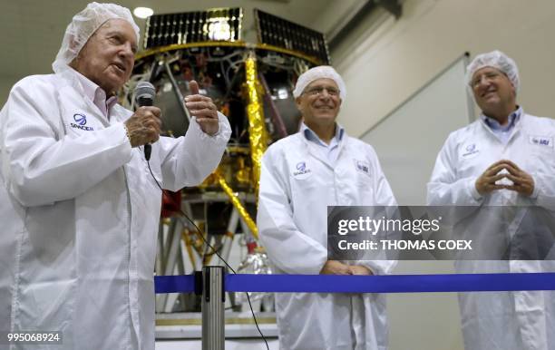 Israeli billionaire and investor Morris Kahn answers to journalists in front of a Israeli Aerospace Industries spacecraft during a press conference...