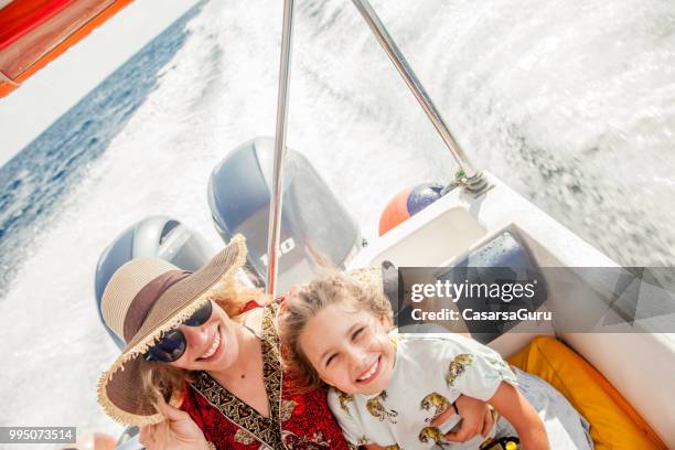 woman and little girl on boat trip - speed boat top view stock pictures, royalty-free photos & images