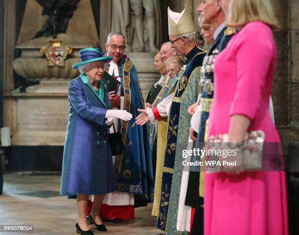Queen Elizabeth II greets Archbishop of Canterbury Justin Welby as she arrives for a service to commemorate The Royal Air Force's 100th Birthday at...