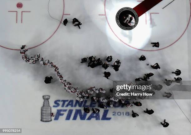 Alex Ovechkin of the Washington Capitals accepts the Stanley Cup from Commisioner Gary Bettman after a 4-3 win over the Vegas Golden Knights in Game...