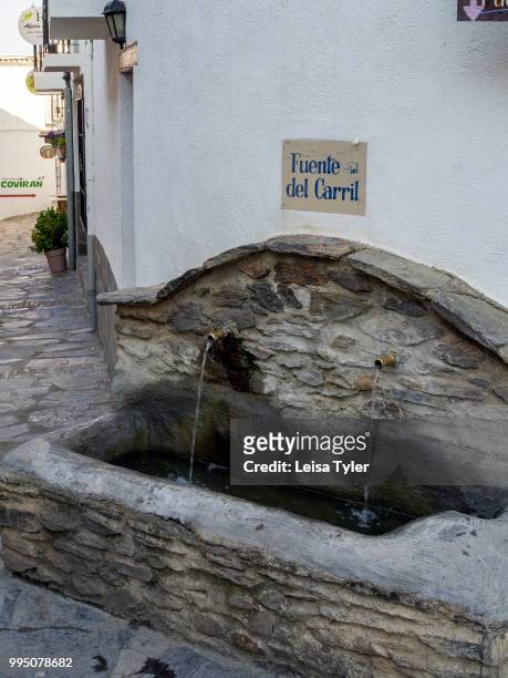 Water fountain in Capileira, the highest and most northerly village on the Poqueira river gorge in the Sierra Nevada, Andalusia, Spain.