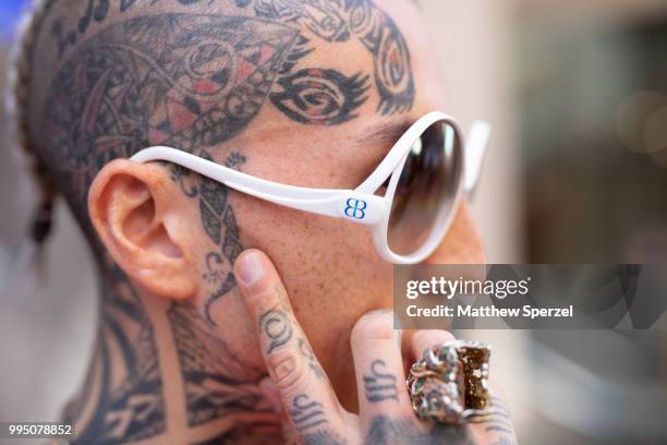 Chris Lavish, Balenciaga sunglasses detail, is seen on the street attending Men's New York Fashion Week on July 9, 2018 in New York City.