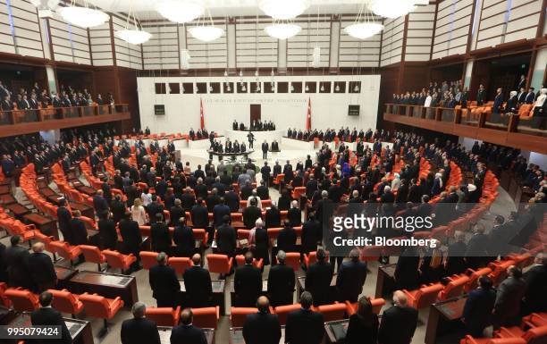 Recep Tayyip Erdogan, Turkey's president, center, takes an oath of office before lawmakers under a new system of government at the Grand National...