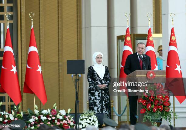 Recep Tayyip Erdogan, Turkey's president, speaks accompanied by his wife Emine Erdogan after being sworn in under a new system of government at the...