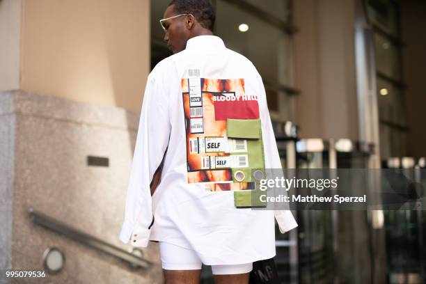 Denzel Bryan, back detail, is seen on the street attending Men's New York Fashion Week wearing Adam Selman with Nike on July 9, 2018 in New York City.