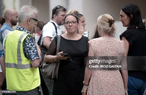 Public prosecutor Cecile Gensac stands in a street after five people including one child were killed when a fire tore through an apartment in Pau,...