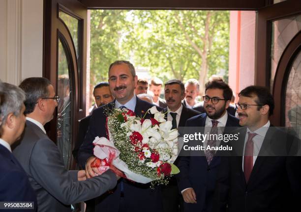 Abdulhamit Gul is welcomed by personnel of the Ministry of Justice after he is appointed as New Minister of Justice in new government system, on July...