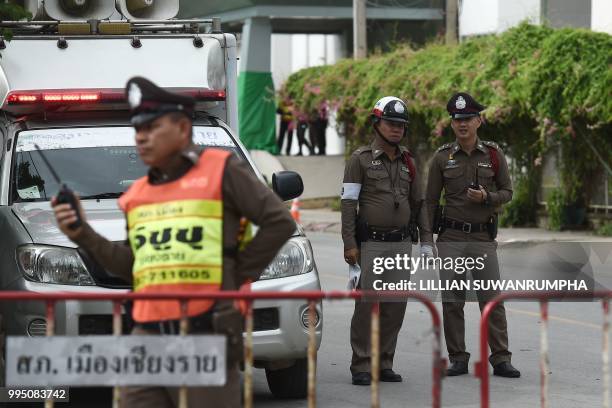 Thai policemen secure the hospital in Chiang Rai where the boys rescued after being trapped in a Tham Luang cave for nearly two weeks have been...