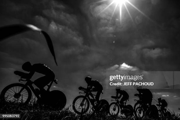 Riders of France's Direct Energie cycling team pedal during the third stage of the 105th edition of the Tour de France cycling race, a 35.5 km team...