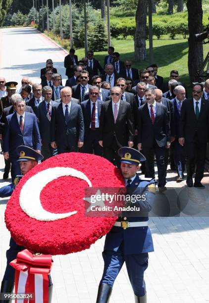 Honor guards carry a Turkish flag wreath during Turkish President Recep Tayyip Erdogan's visit to the grave of Heydar Aliyev, Former President of...