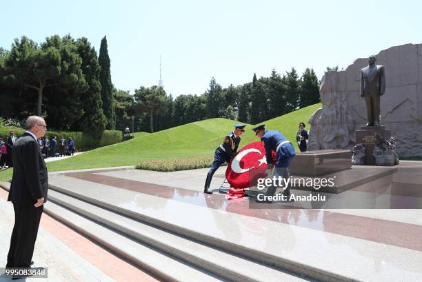 Honor guards place a Turkish flag wreath at the grave of Heydar Aliyev, Former President of Azerbaijan, during Turkish President Recep Tayyip...
